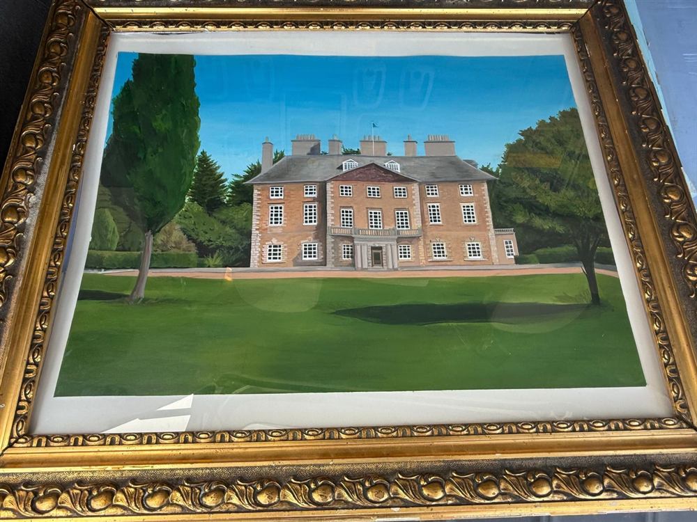 Framed gouache painting of a brick manor house