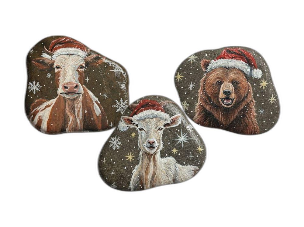 Three stones painted with Christmas animals